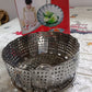 Stainless steel foldable basket for steaming and drying dishes.
